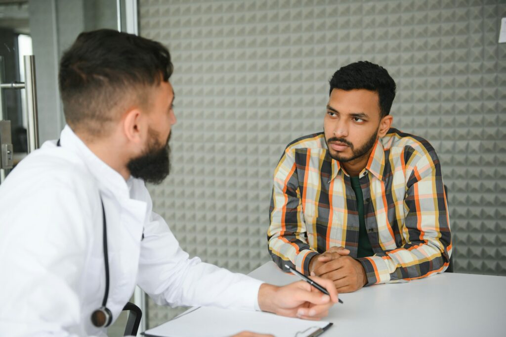 An Indian man is being examined by a doctor. Arab doctor. Health concept